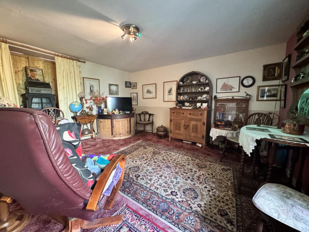Lot: 101 - TWO-BEDROOM HOUSE FOR IMPROVEMENT IN VILLAGE LOCATION - Living room